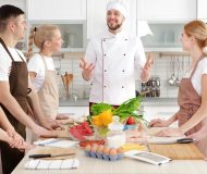 Male chef and group of people at cooking classes; Shutterstock ID 633405473; Purchase Order: -